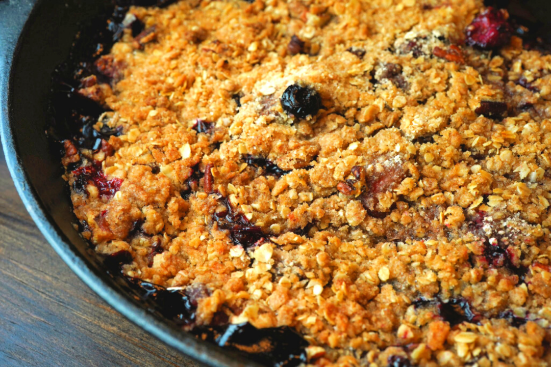 Mixed berry crisp in cast iron pan